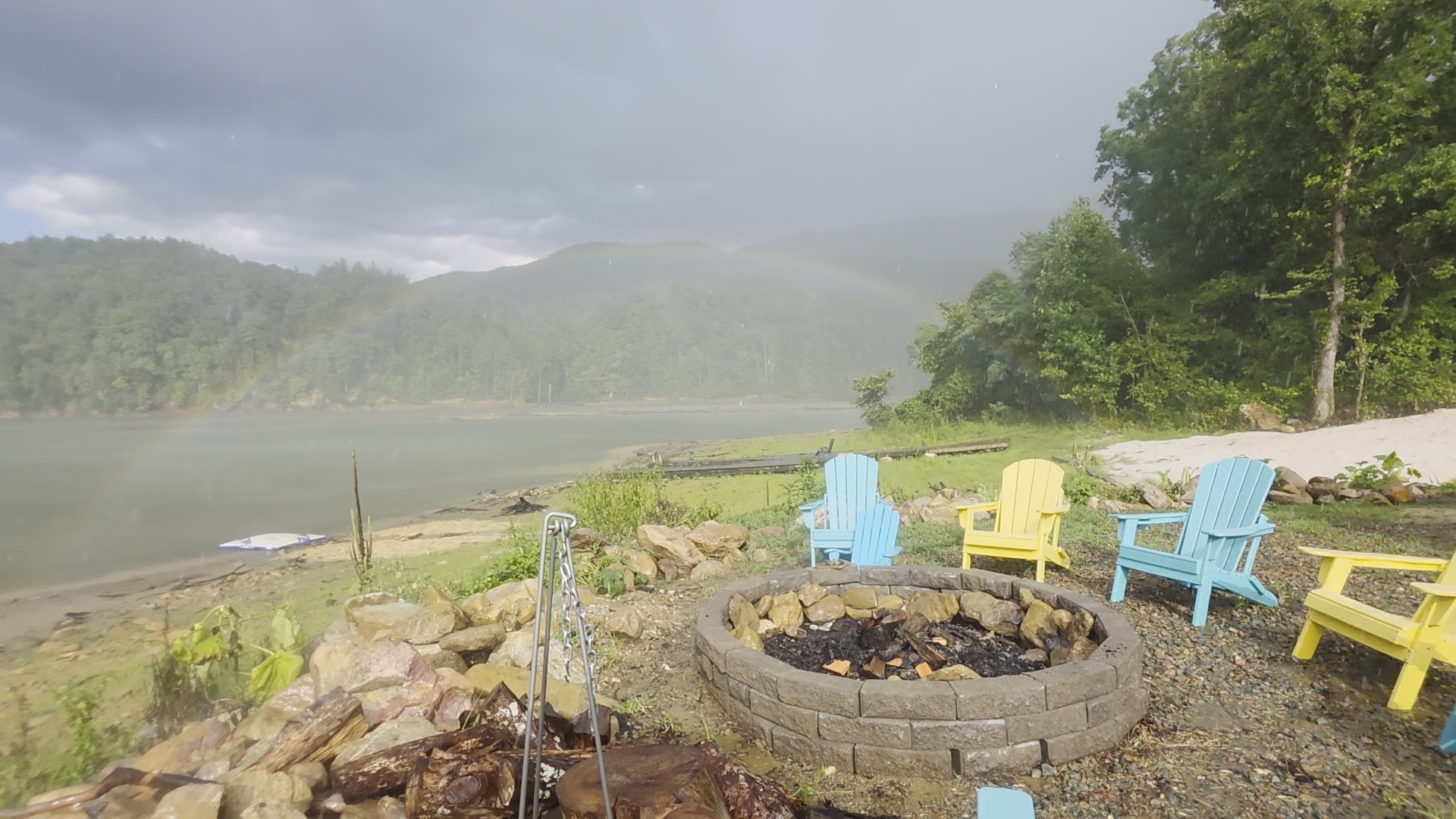 A rainbow over the lake after a summer sunshower, seen from the firepit chairs