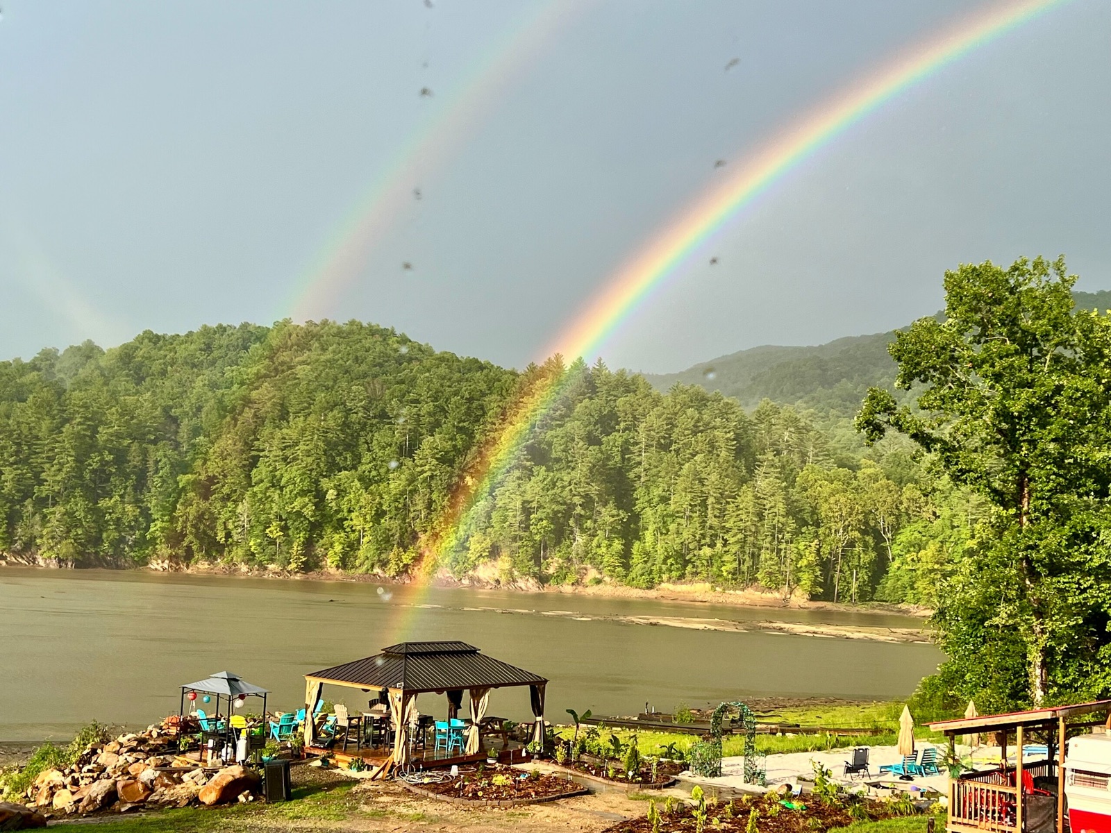 Double rainbow over the lake, gazebo, and gardens at Tn-Buc-Tu